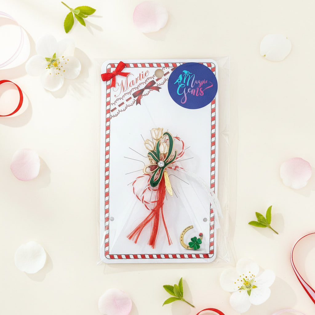 The Verdant Snowdrop Cluster Martisor Brooch elegantly displayed on a storytelling card, complete with the Martisor's historical tale.