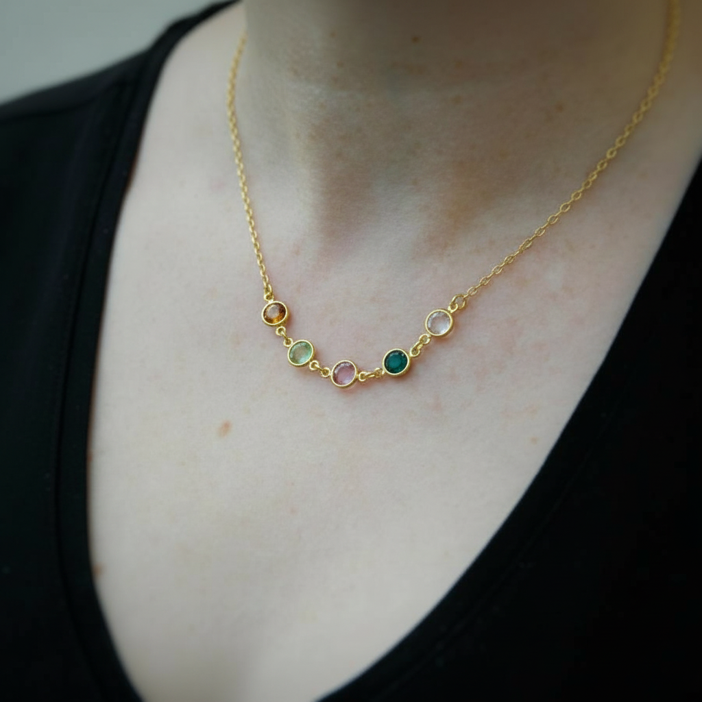 Gold family birthstone necklace with five personalised Austrian crystal birthstones, handcrafted in Ireland by Magpie Gems – meaningful gift for mums and grandmothers.