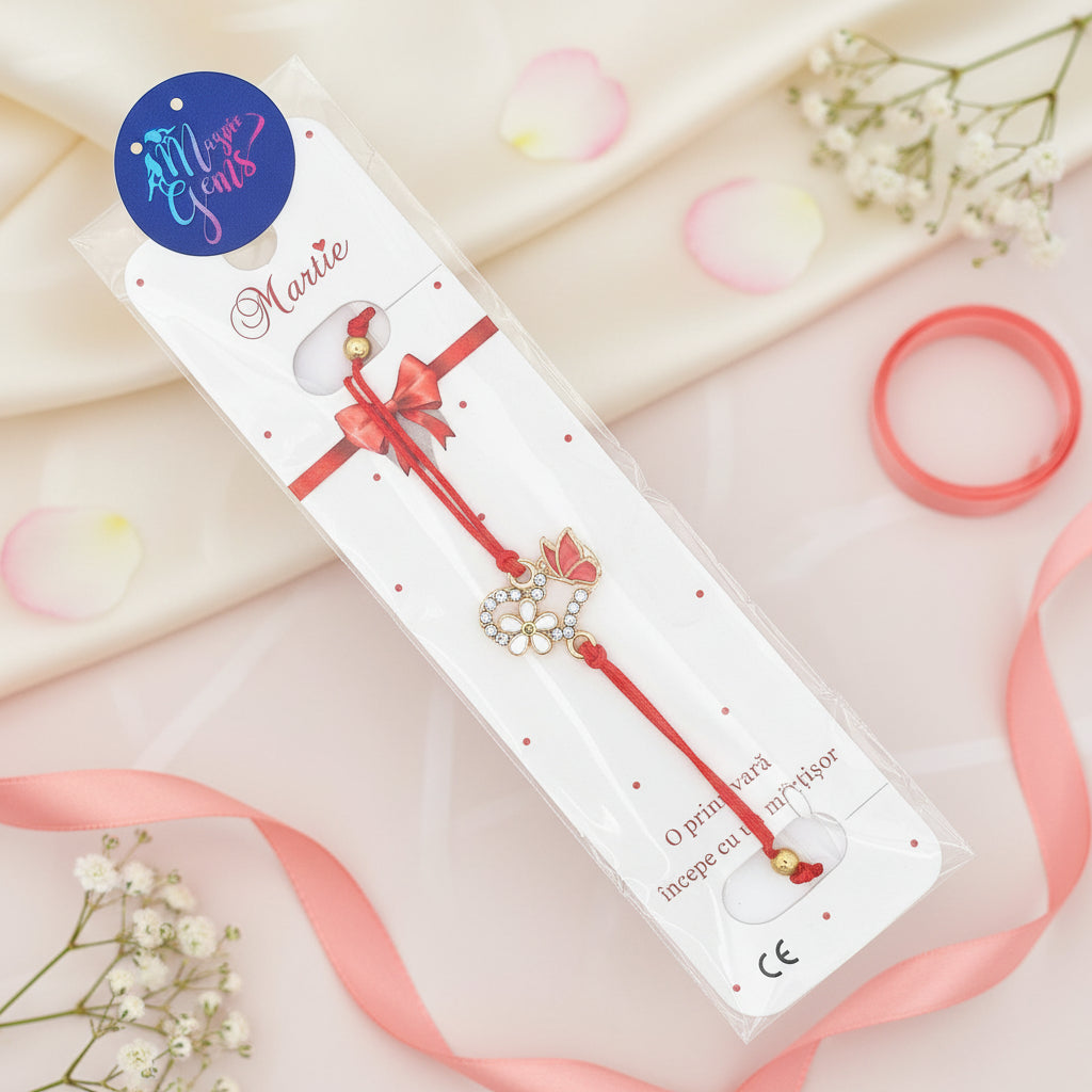 The 'Spring Harmony' Martisor Bracelet elegantly placed on a branded card inside a transparent bag, ready for gifting on the 1st of March, with the red butterfly and flower charms highlighted against the white packaging.