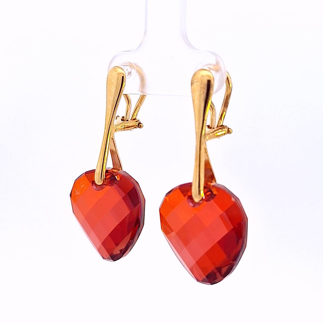 Elegant side view of Crimson Cascade Gold Clip-On Earrings, highlighting the depth of the Red Magma crystals.