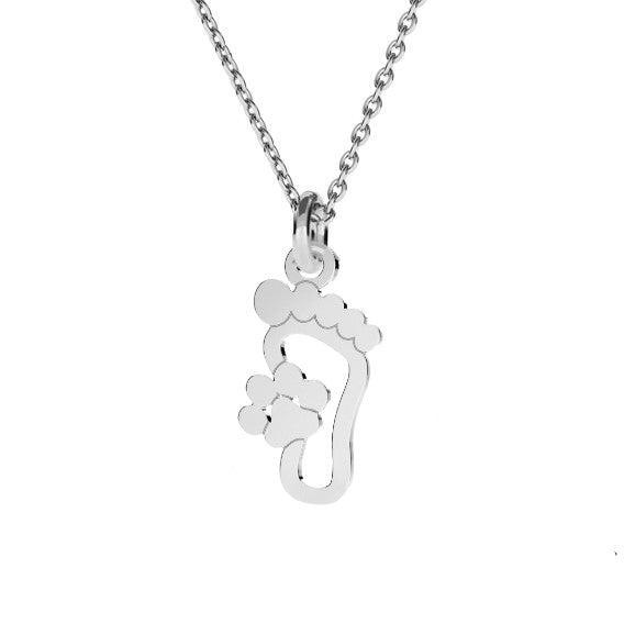 Sterling silver foot with paw print pendant on a chain representing a pet's journey alongside its owner - 'Paw Path' Necklace by Magpie Gems.