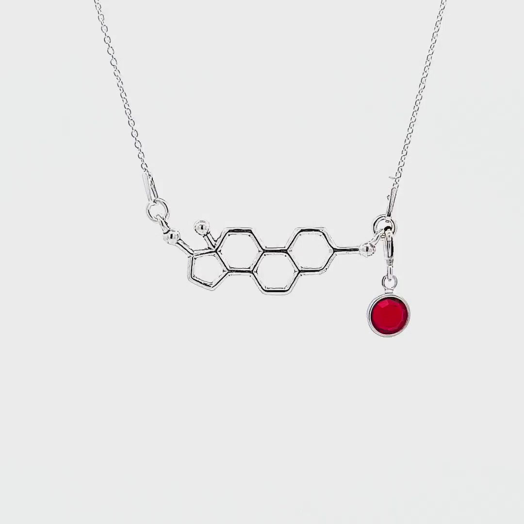 Video of Magpie Gems's Estrogen Molecule Necklace in Sterling Silver with Detachable Birthstone Crystal, made in Ireland for women and science enthusiasts.