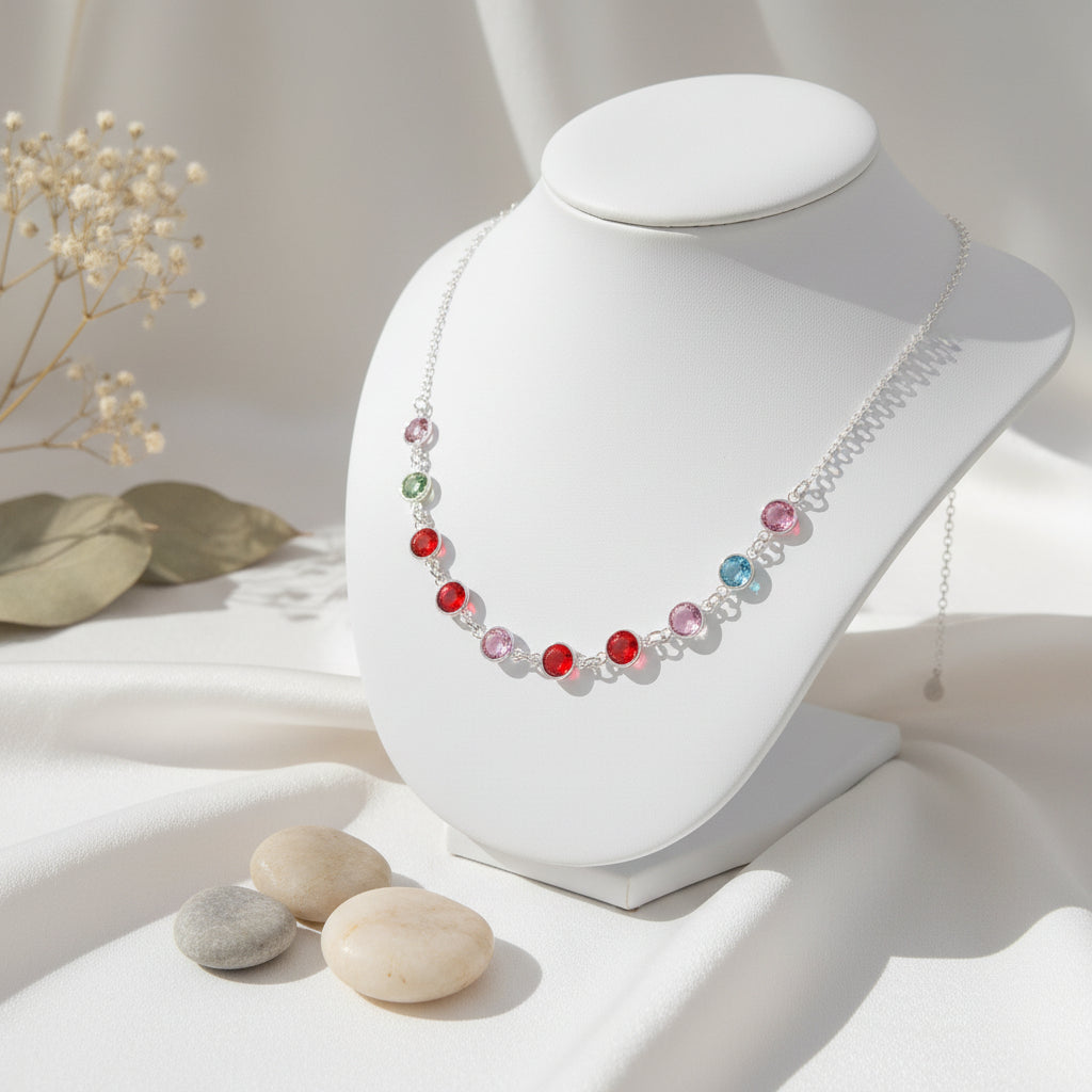 Family birthstone necklace in sterling silver with multicolour crystals displayed on stand, handmade by Magpie Gems Ireland.
