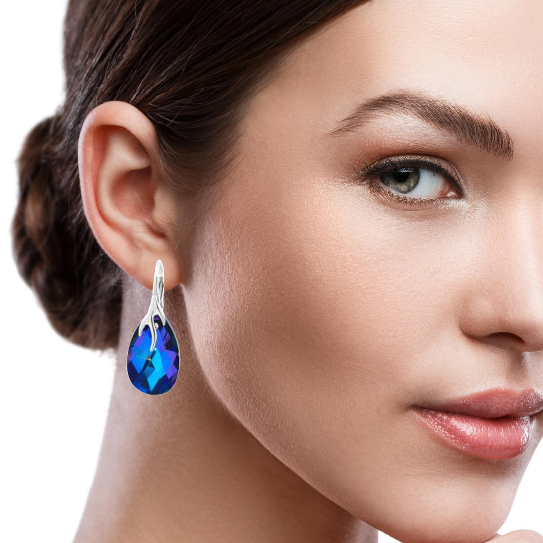 Stylish Tear-Drop Silver Earrings with 22mm Pear-Shaped Crystal worn by a model.