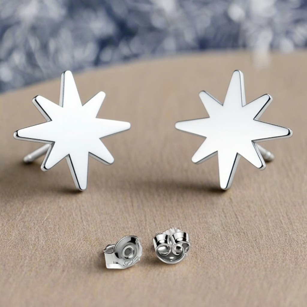 Winter Star Sterling Silver Stud Earrings – artistic display of 8.5mm star design on wooden background