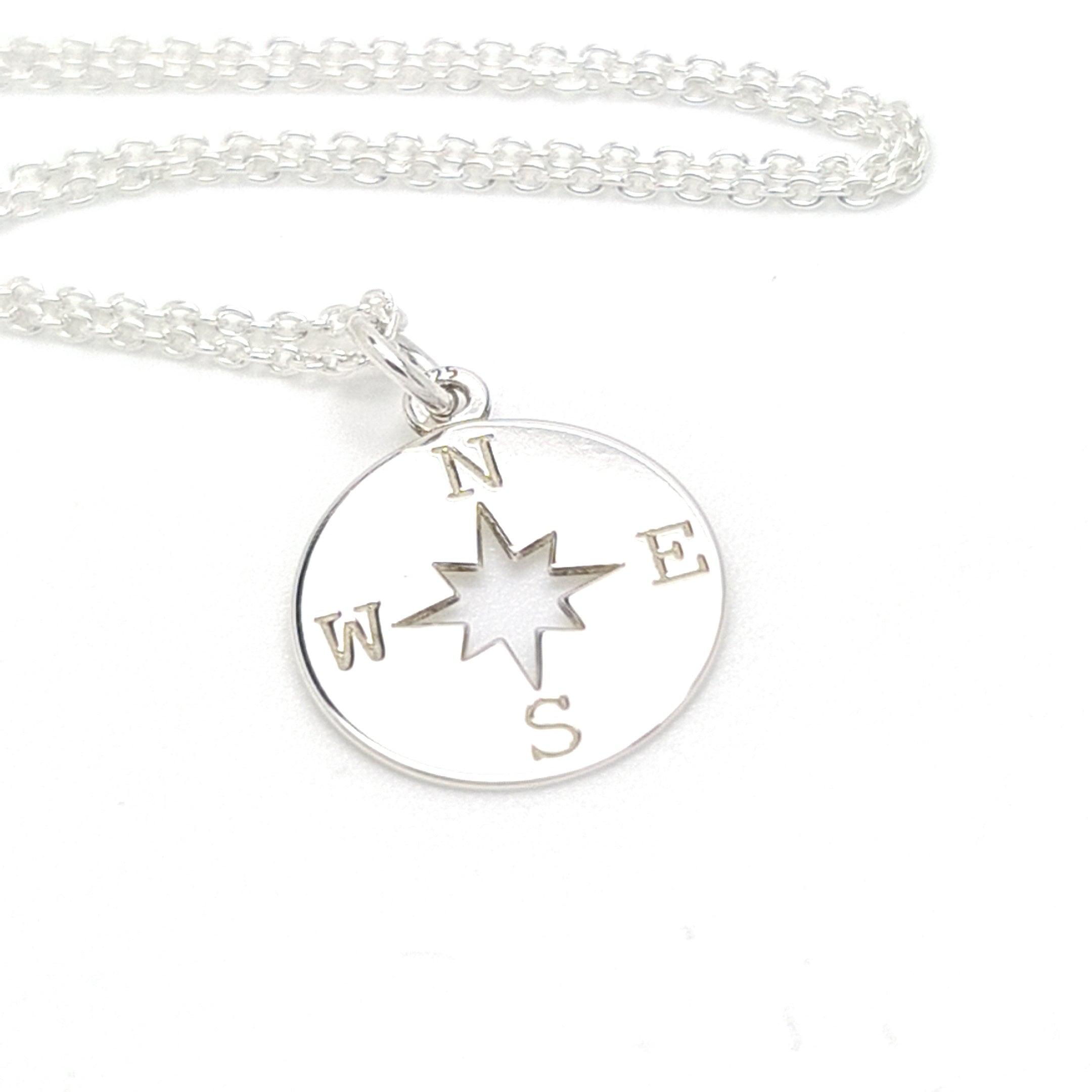 Sterling silver compass necklace with adjustable chain by Magpie Gems, illustrating guidance and personal exploration.