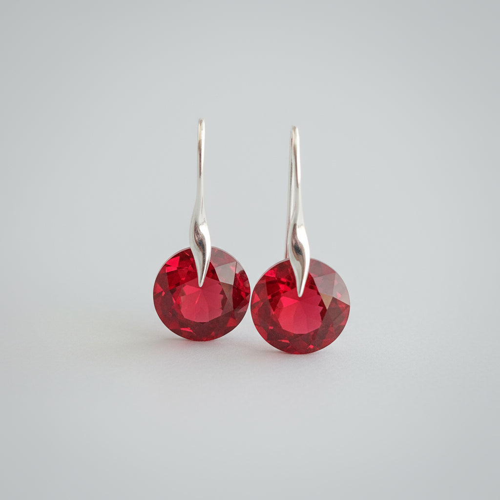 Light Siam red crystal July birthstone drop earrings in sterling silver with leverback hooks by Magpie Gems.