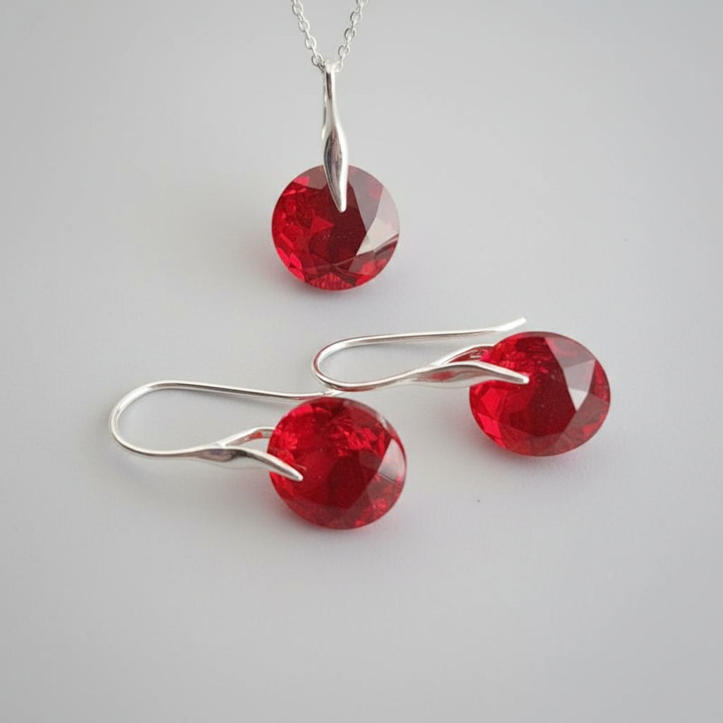 July birthstone jewellery set with Light Siam red crystal pendant and matching sterling silver earrings by Magpie Gems.