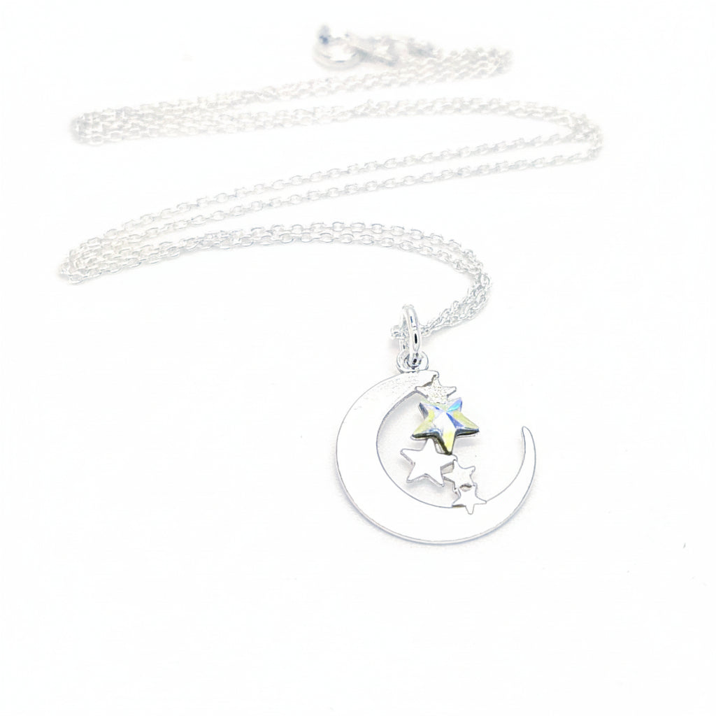Sterling silver necklace with crescent moon and stars pendant on fine chain made in Ireland