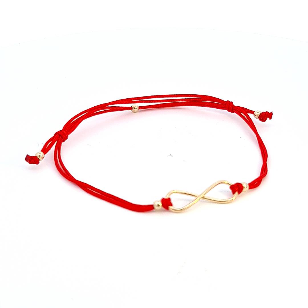 Frontal view of the Infinite Bonds Red String Bracelet displaying the 14k solid gold infinity symbol at the centre.