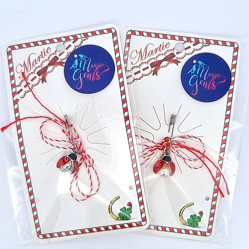 Front view of the 'Ladybug Whispers' Martisor charm with a rhinestone, alongside the one with a pearl, both elegantly presented for gifting.