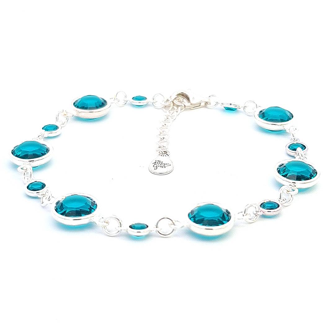 December birthstone sterling silver link bracelet, inlaid with turquoise crystal connectors, evoking protection and healing, crafted by Irish artisan.