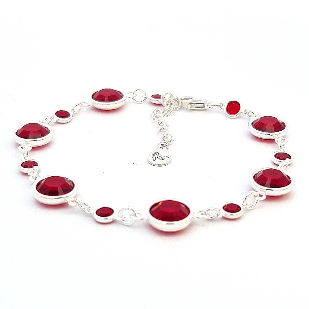 Handcrafted sterling silver link bracelet, featuring a delicate array of January birthstone crystals, garnet siam, adding a deep red sparkle to the wrist, made in Ireland.