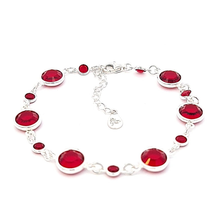 July birthstone sterling silver link bracelet, bejeweled with ruby crystals to symbolize passion and energy, meticulously handcrafted in Ireland.