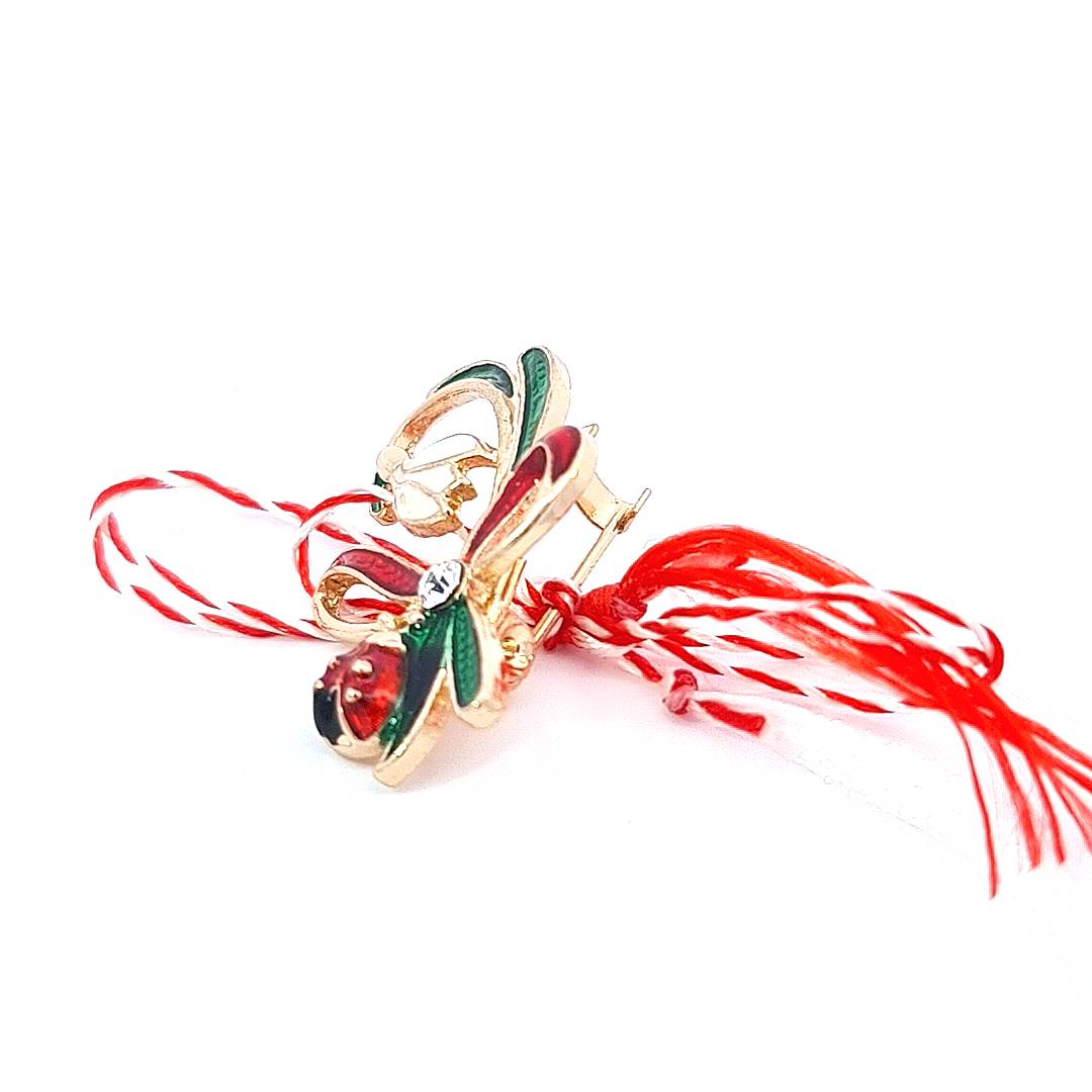 Side perspective of the Martisor Brooch, highlighting the gold-plated curvature and enamel depth.
