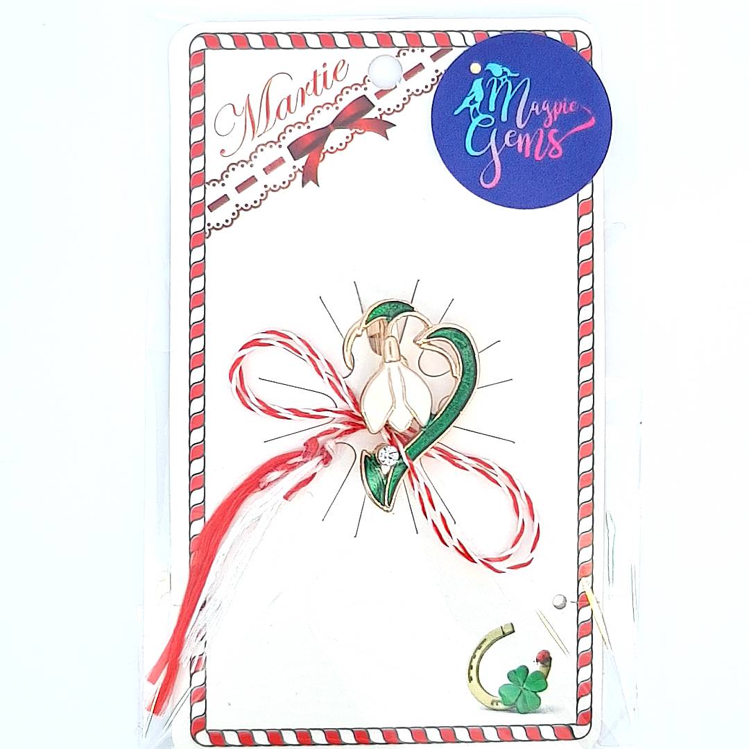 The Solitaire Snowdrop Martisor Brooch presented on a card with the Martisor story, a perfect gift for celebrating tradition and elegance.