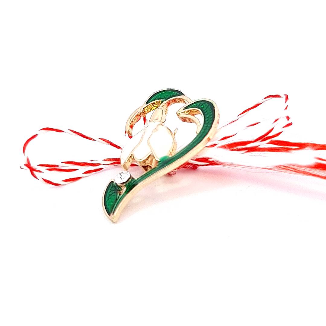 Profile view of the Solitaire Snowdrop Martisor Brooch, accentuating the enamel contours and rhinestone sparkle.