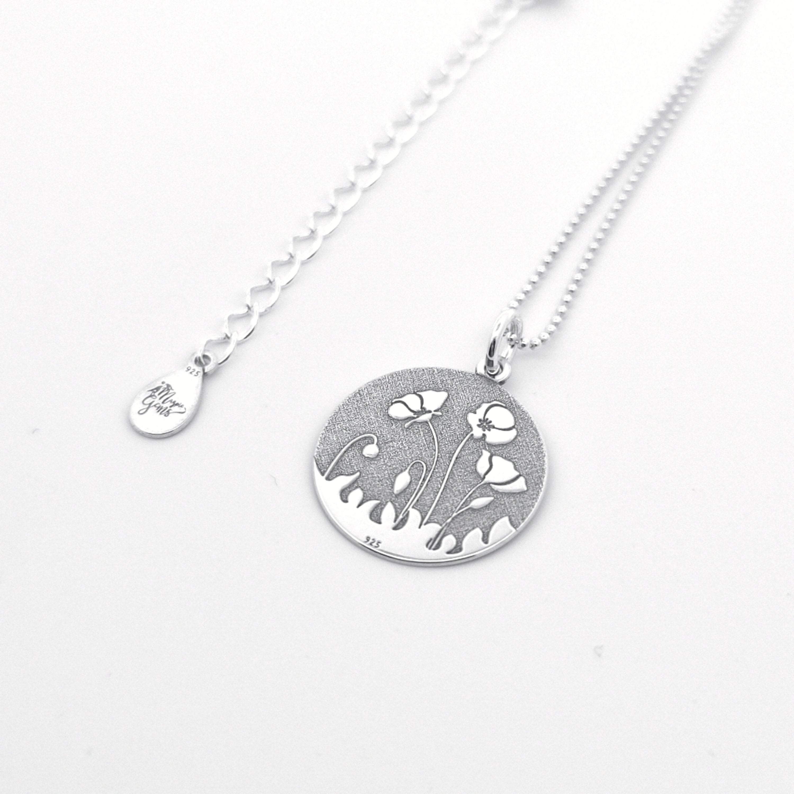 Poppies Pendat Necklace - Silver necklace with a floral pendant on a white background