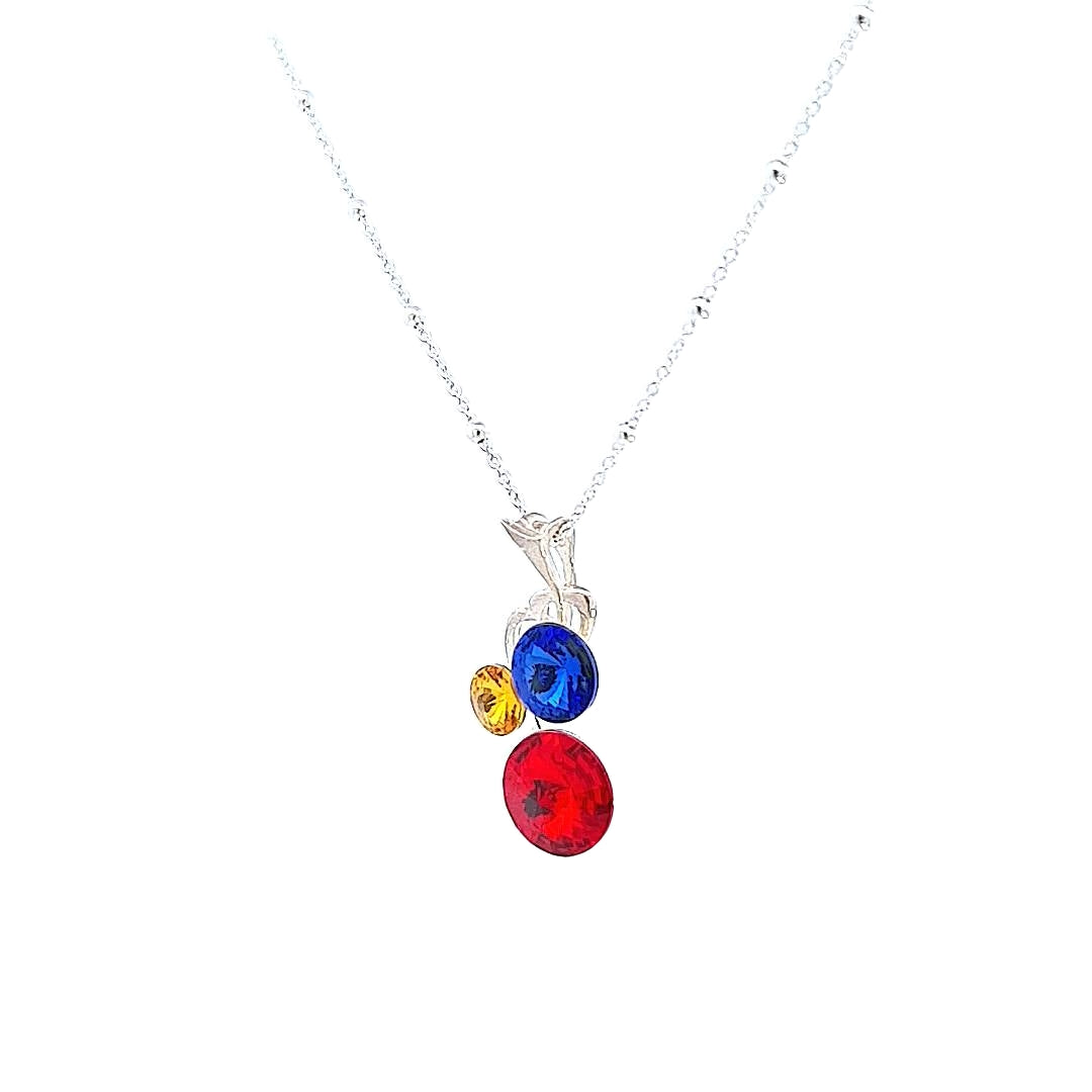 Side View of Harmony of Heritage Sterling Silver Pendant Showing the Intricate Setting of Red, Yellow, and Blue Crystals