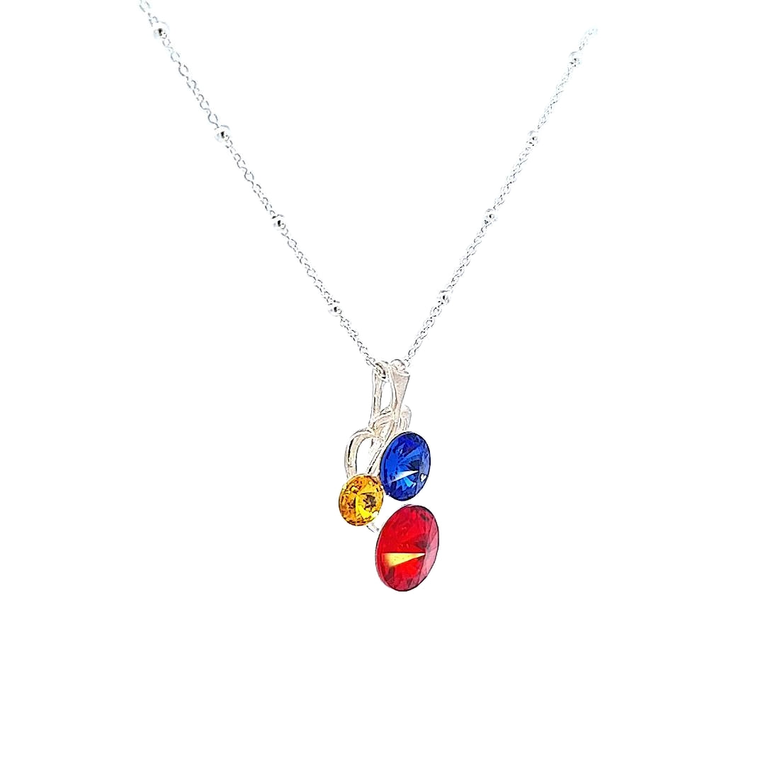 Angled Close-Up of Romanian and Moldavian Flag Inspired Silver Pendant Necklace Highlighting the Clarity and Brilliance of the Side-Set Crystals