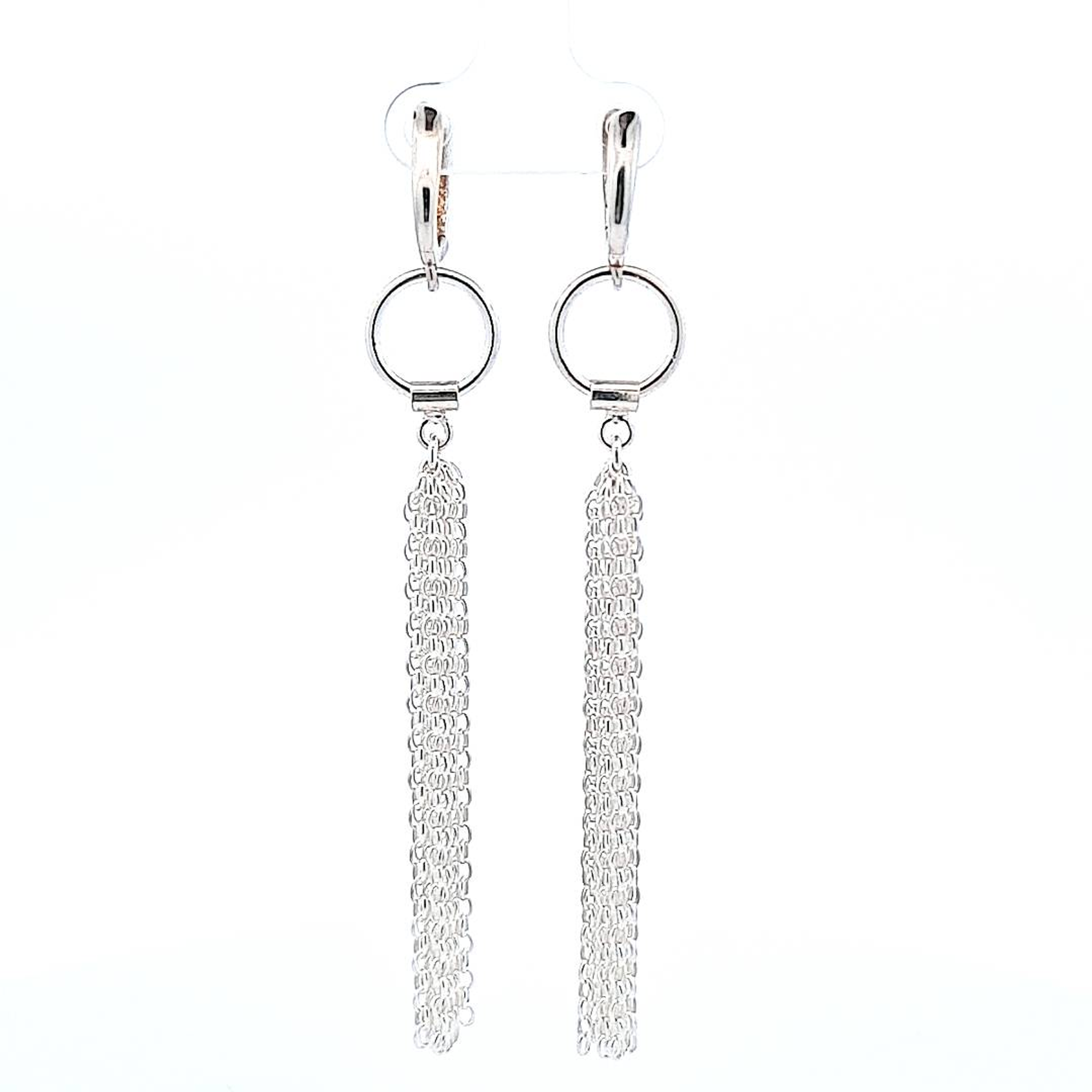 Elegant sterling silver waterfall tassel earrings by Magpie Gems, reflecting light with delicate chains.