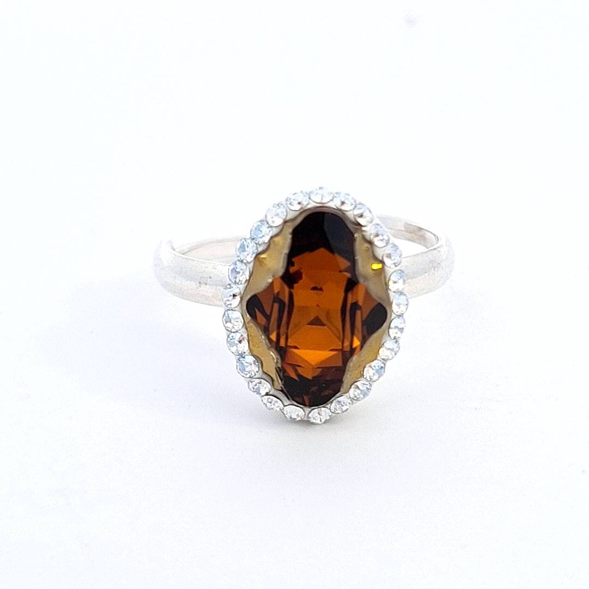 Magpie Gems' Tribe Crystal Amber Aura Halo Ring in Sterling Silver, showcasing an Austrian Tribe crystal.