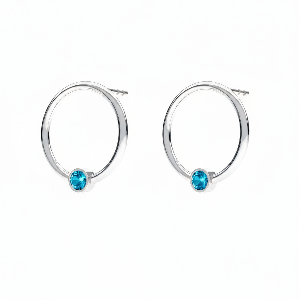December birthstone circle earrings in sterling silver with turquoise blue crystal, handcrafted by Magpie Gems Ireland