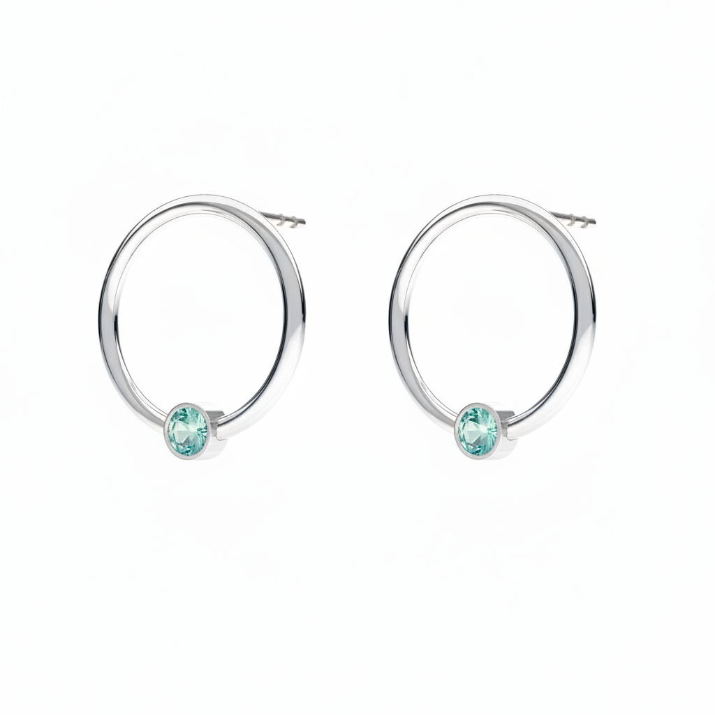 March birthstone circle earrings in sterling silver with light blue Aquamarine crystal, handcrafted by Magpie Gems Ireland