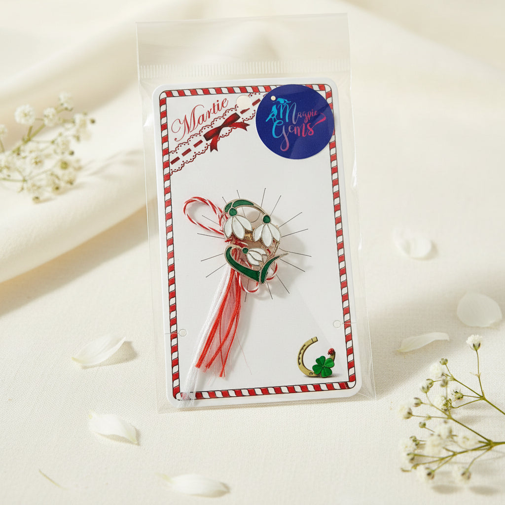 Romanian spring tradition - 'Vestitorul Primăverii' snowdrop brooch with red and white Martisor string.