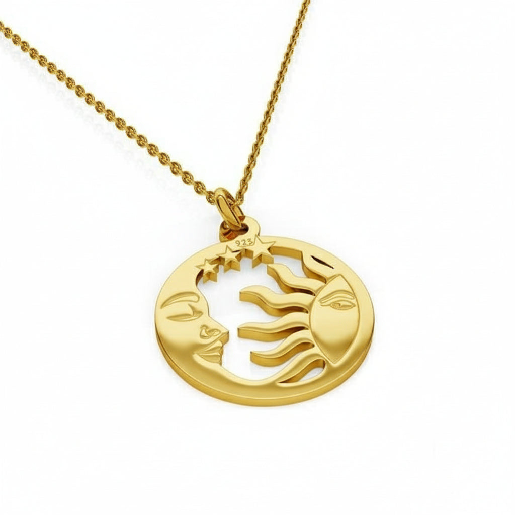 24k gold-plated 'Celestial Harmony' necklace featuring a circular pendant with intricately carved sun on one half and crescent moon with stars on the other, crafted from nickel-free sterling silver, suspended on a delicate chain.