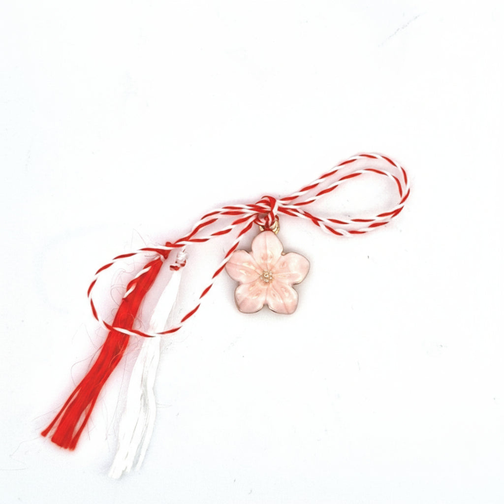 herry Blossom Martisor Charm Pendant featuring soft pink enamelled blossoms with golden accents, ideal for welcoming spring.