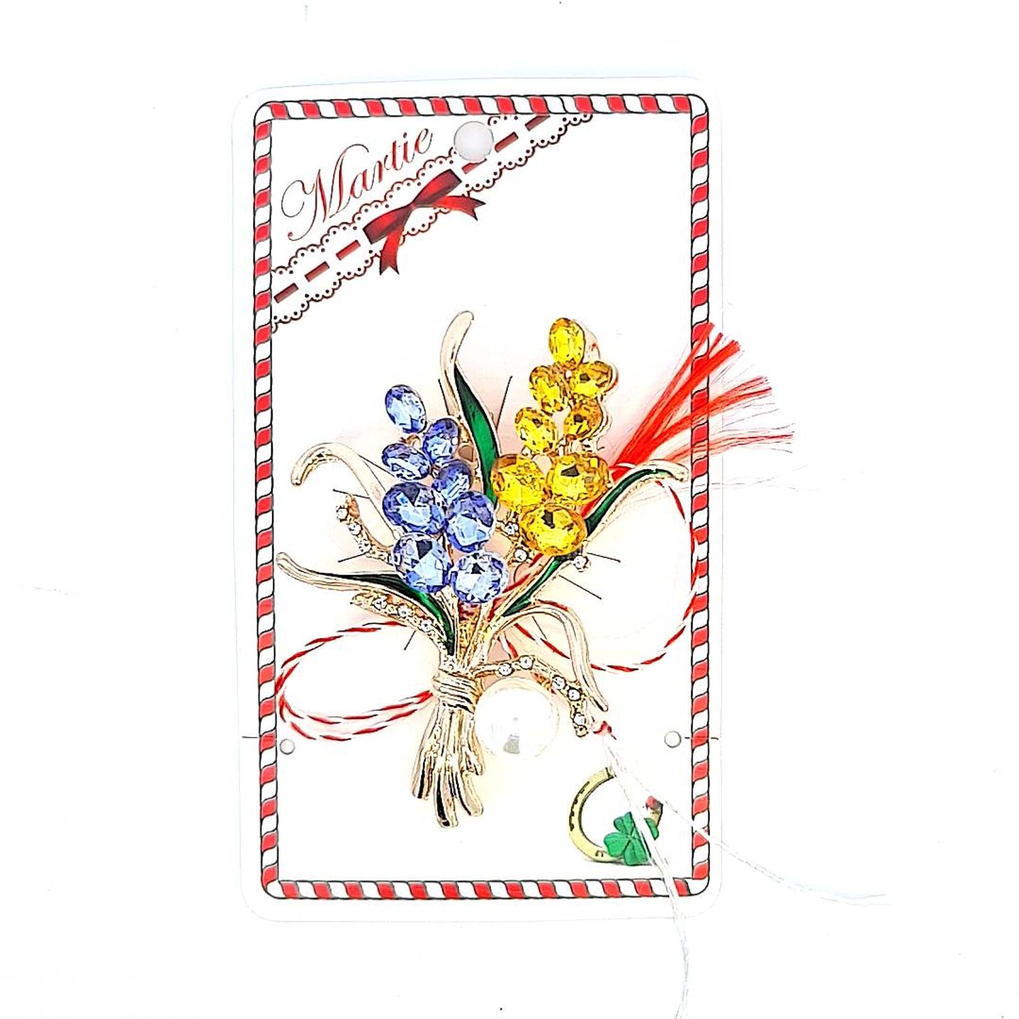 Pearlescent Harmony' Martisor brooch placed on a storytelling card, sharing the Martisor legend against the backdrop of the traditional string.