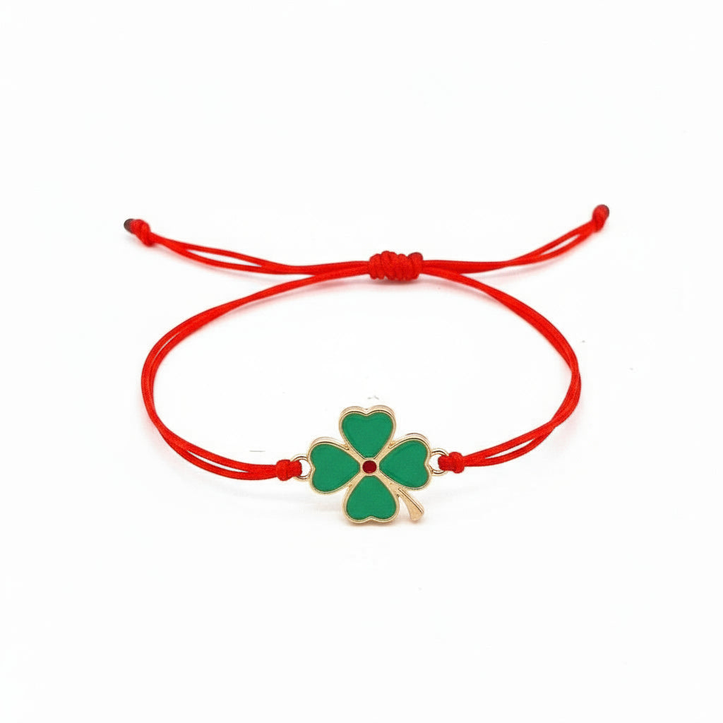 Chic 'Clover Wishes' Martisor Bracelet with a gold-plated four-leaf clover charm on an adjustable red macramé cord, ready for gifting