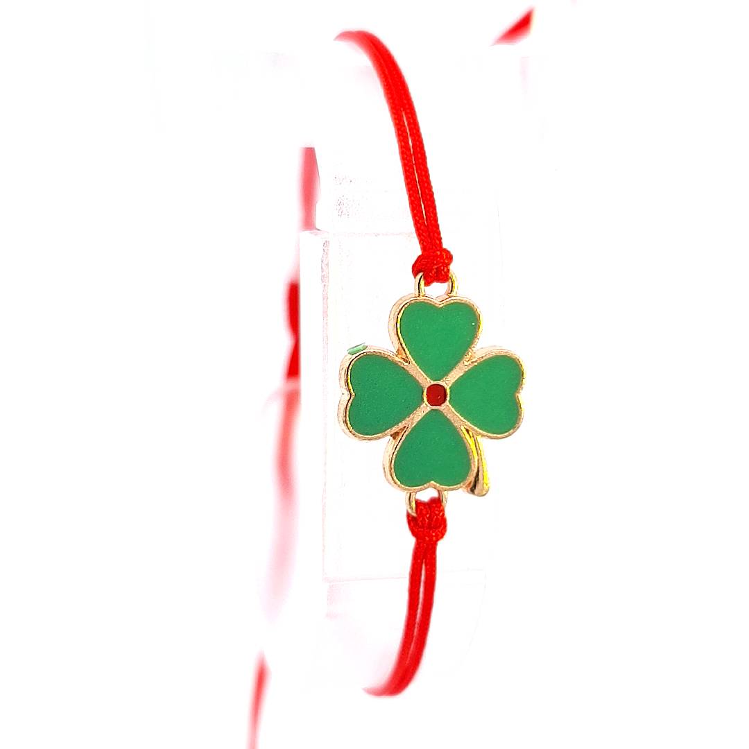 Zoomed-in view of the 'Clover Wishes' Martisor Bracelet's four-leaf clover charm, showcasing the intricate gold plating and green enamel work.