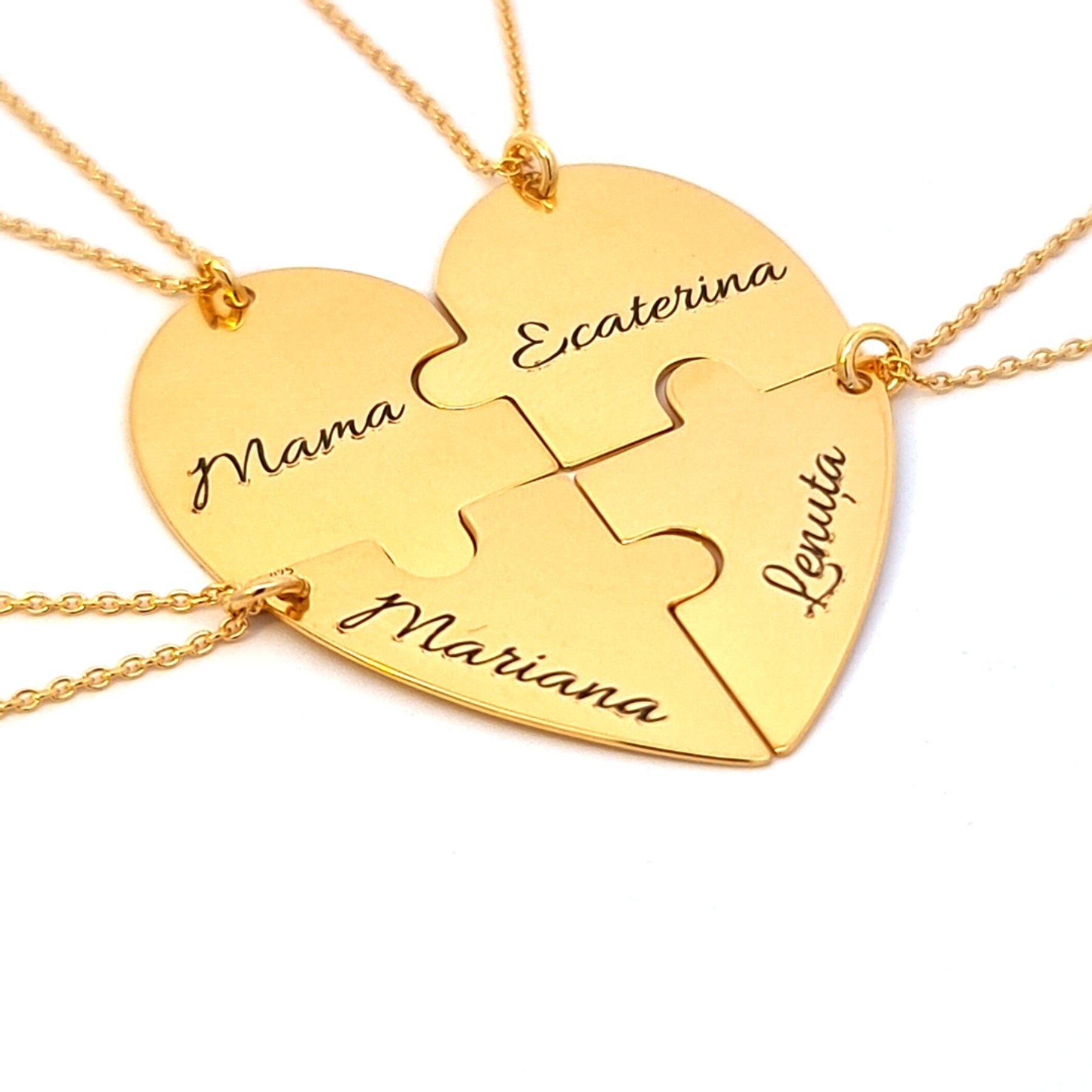 Close-up of personalised gold puzzle heart necklace engraved with family names, made in Ireland by Magpie Gems.