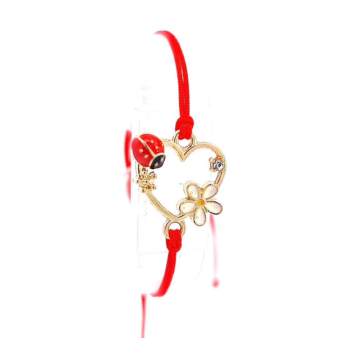  'Heartfelt Blossom' Martisor Bracelet, showcasing the heart charm's intricate design and the lucky ladybird.