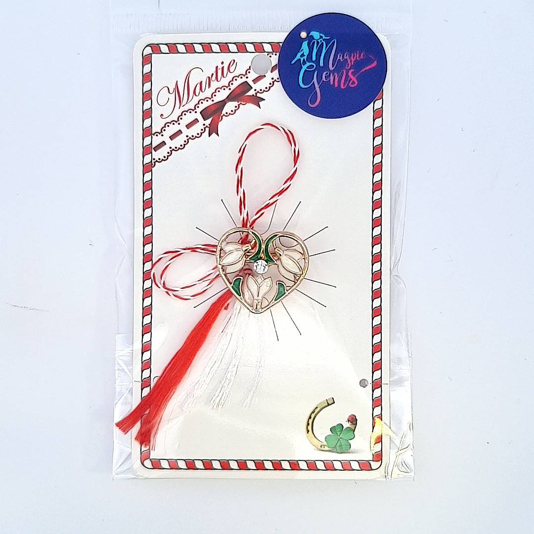 Packaged 'Heart of Spring' Snowdrops Martisor brooch from Magpie Gems, ready for gifting with traditional red and white string.