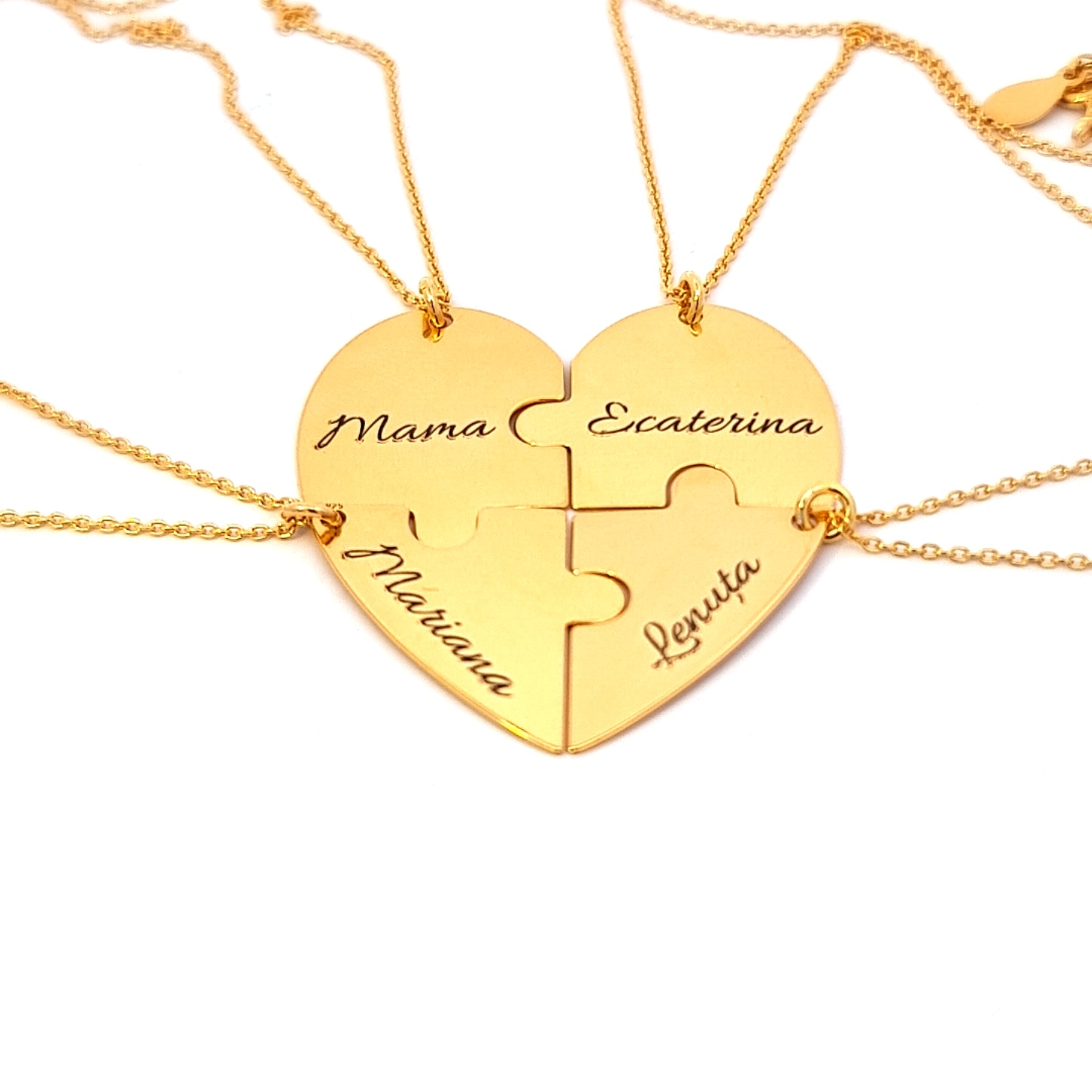 Custom gold heart puzzle necklace with 4 engraved names on interlocking pieces, handcrafted in Ireland by Magpie Gems.