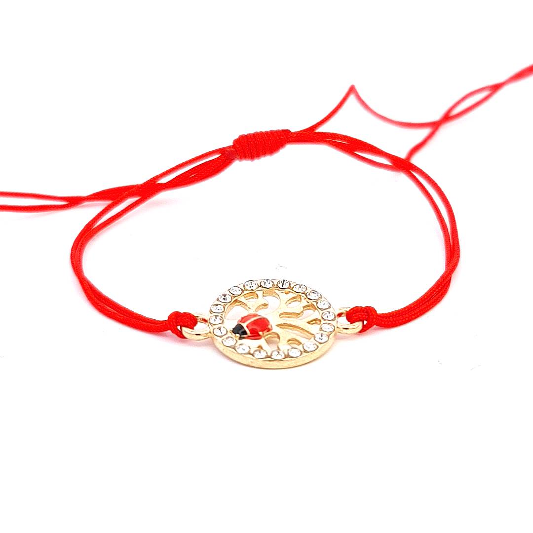 Exquisite 'Vitality Spark' Martisor Bracelet with a gold-plated Tree of Life charm adorned with a ladybird and crystals on a vibrant red adjustable cord. Handmade in Ireland