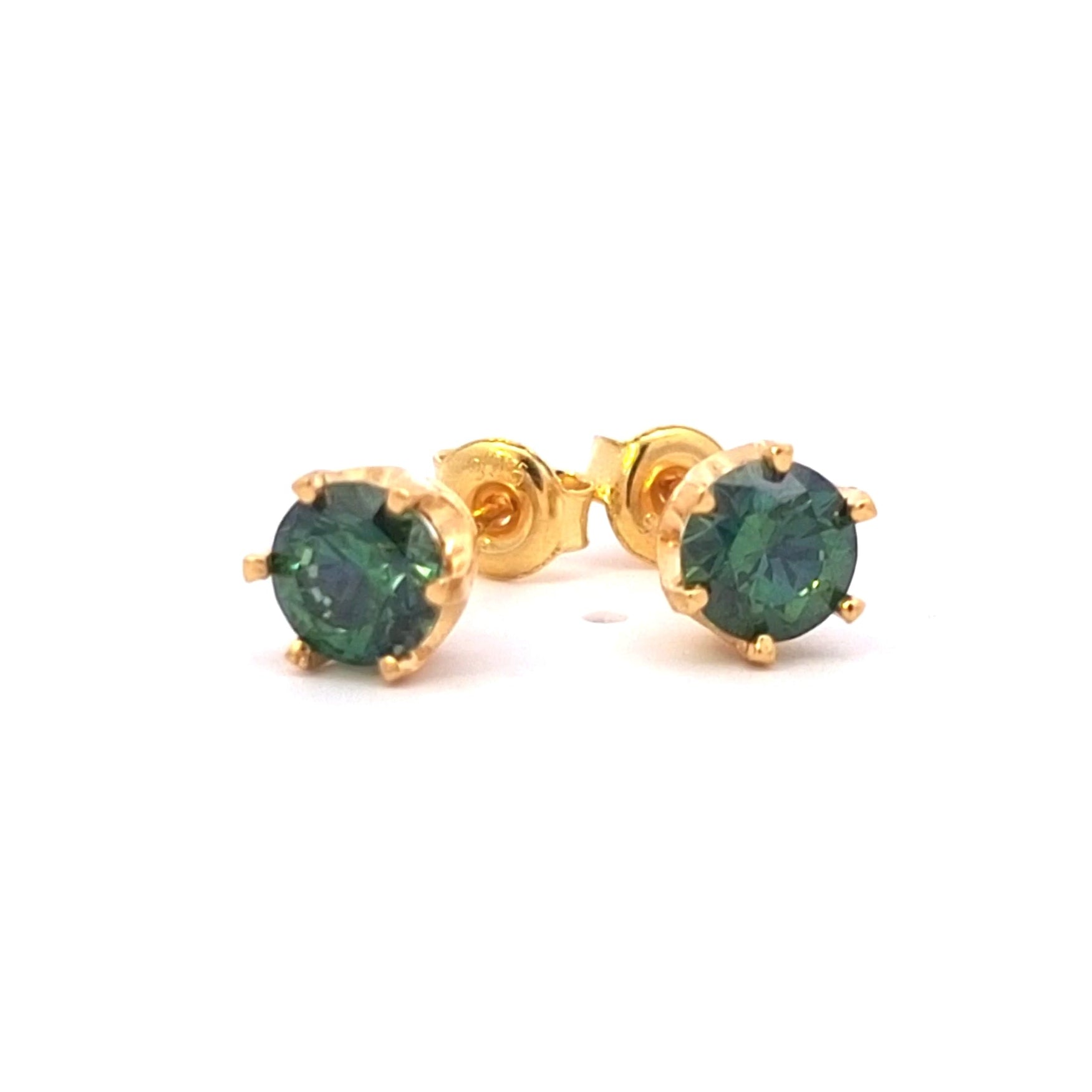 Gold stud earrings with green gemstones on a white background. Green Cubic Zirconia stud earrings in 24k gold-plated silver