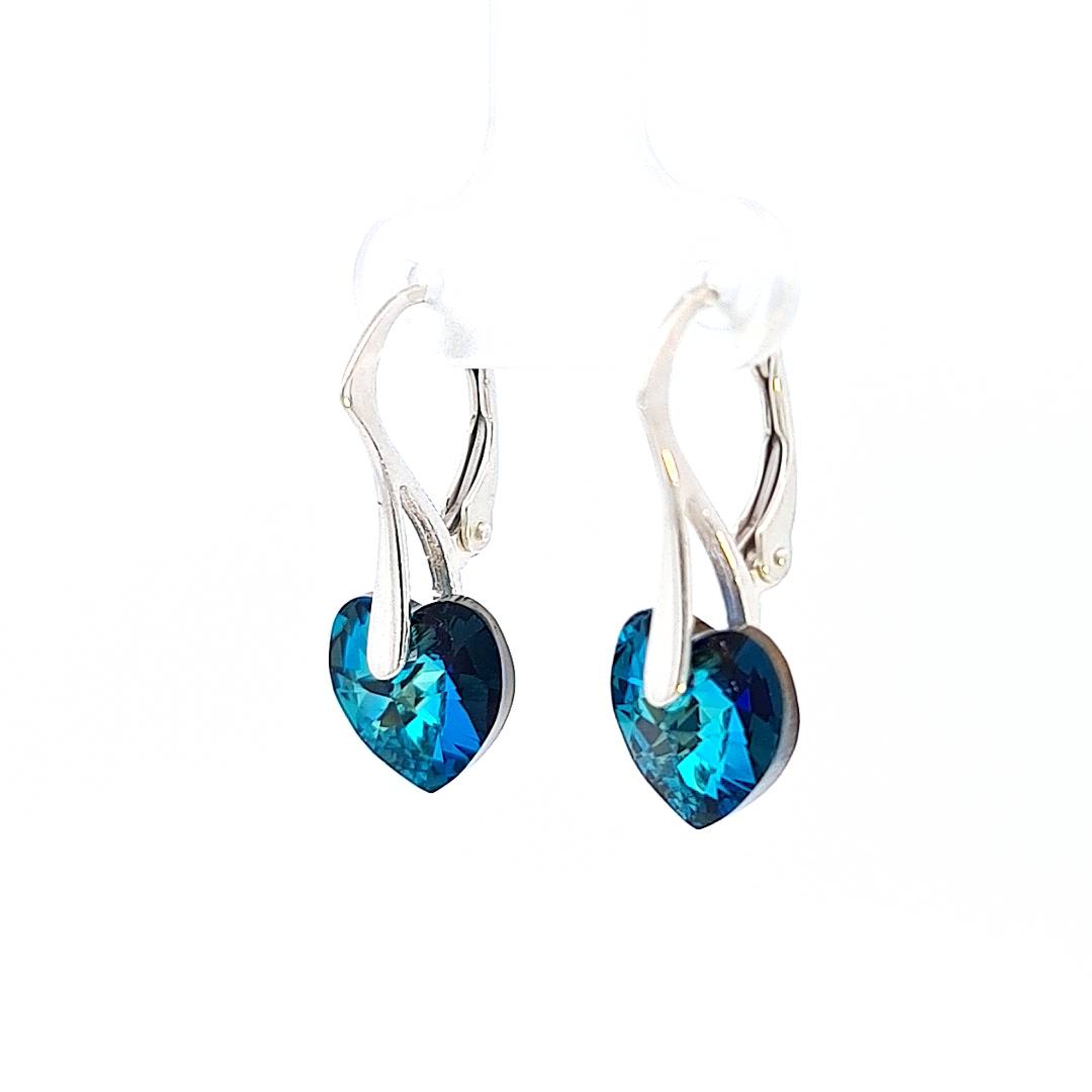Side View of Bermuda Blue Dainty Heart Earrings - Showcasing the Depth of Colour and Sterling Silver Craftsmanship