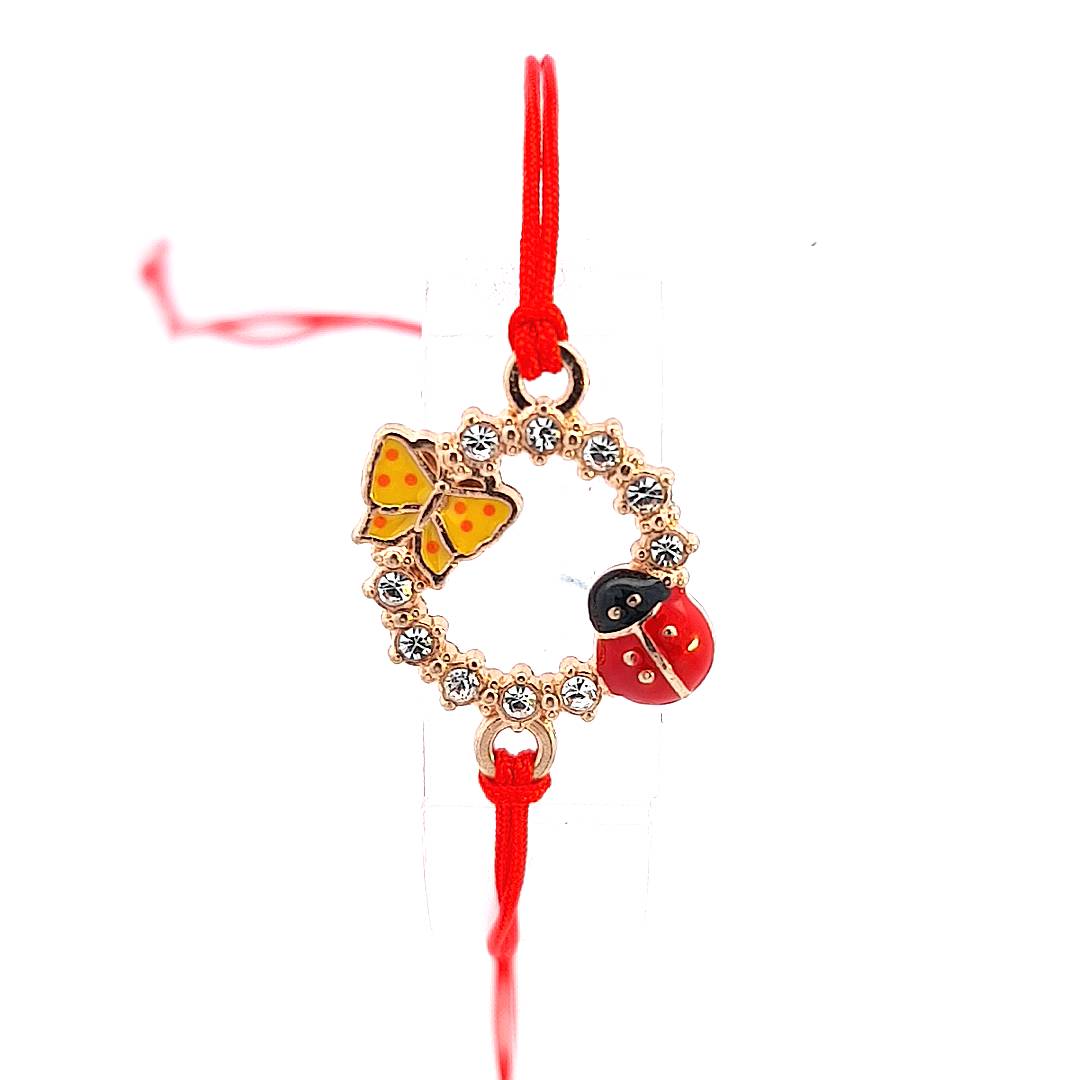 Detailed view of the 'Spring's Promise' Martisor Bracelet's circle charm, highlighting the bright enamel ladybird, the colourful butterfly, and the glittering crystals.