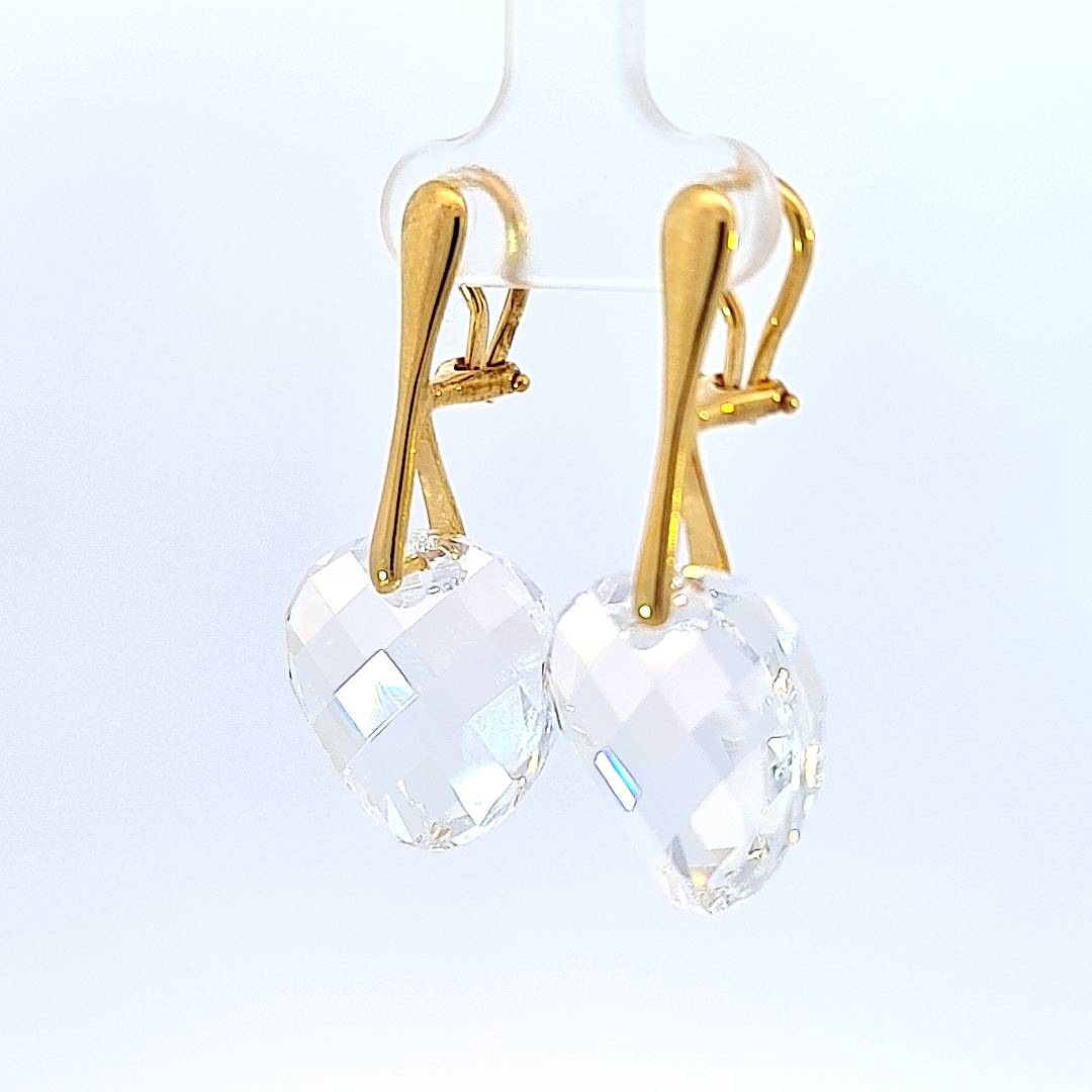 45-degree side view of Celestial Gleam Earrings, highlighting the gold plating and secure clip-on design.