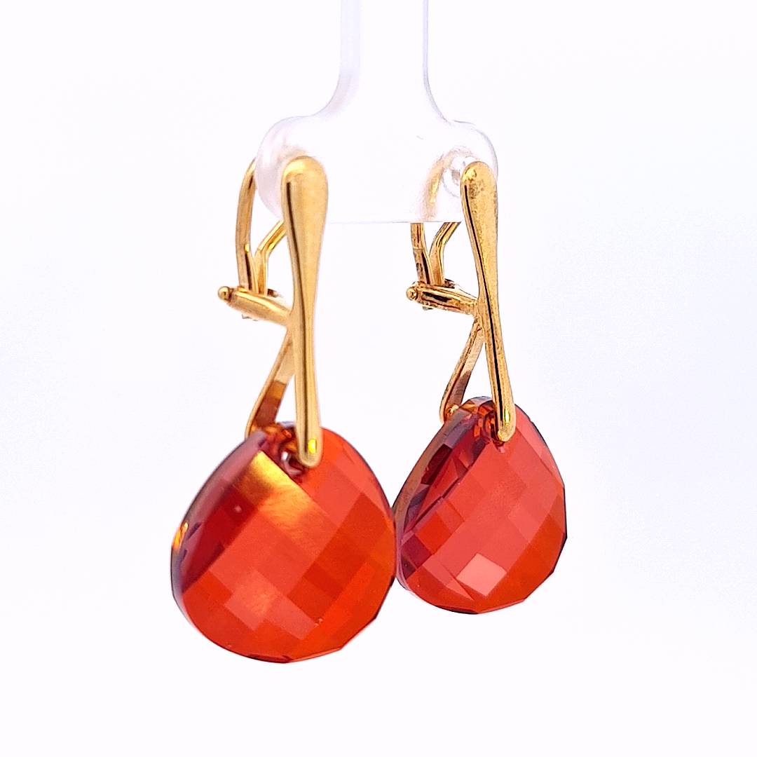 Elegant side view of Crimson Cascade Gold Clip-On Earrings, highlighting the depth of the Red Magma crystals.