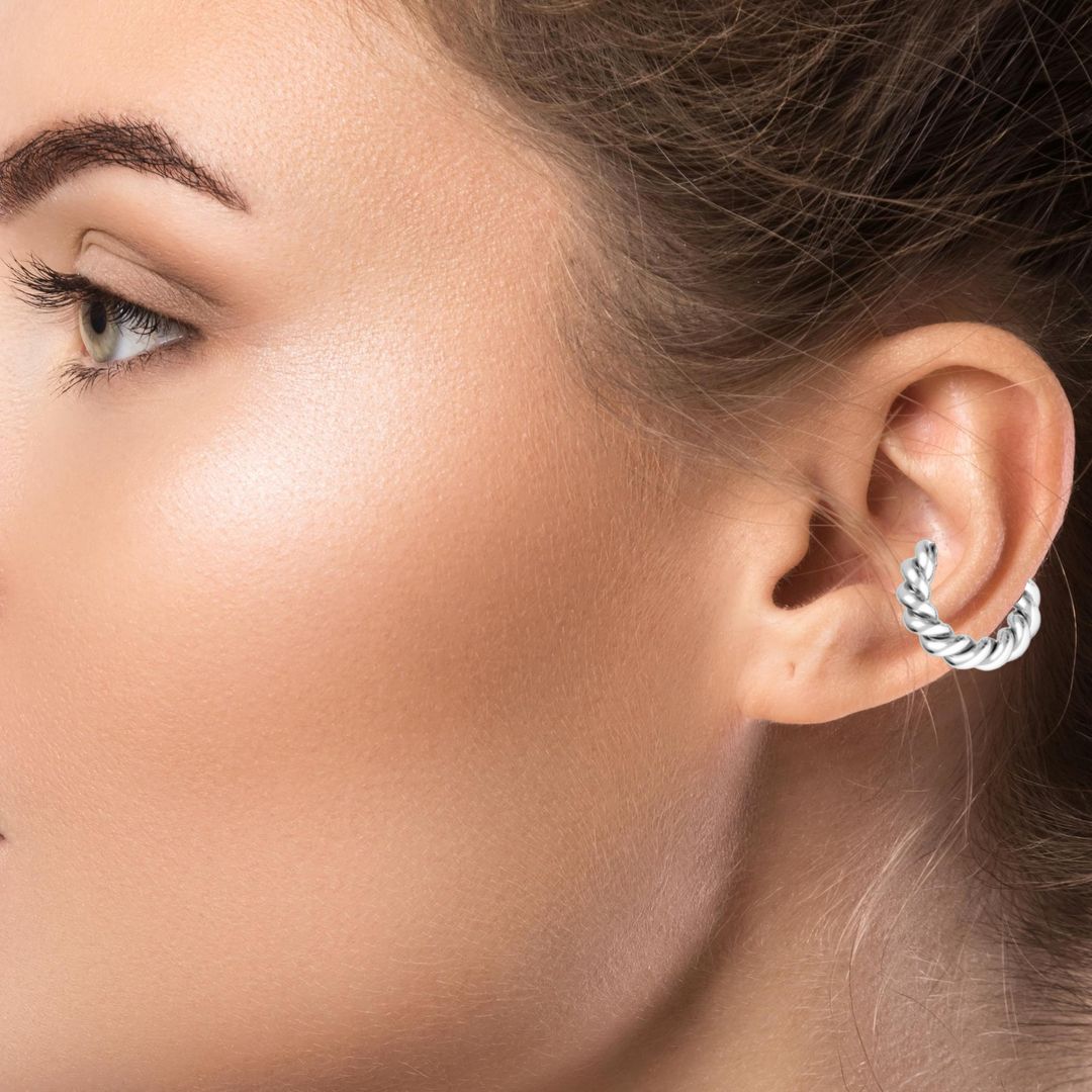 Women wearing a Large Twisted Ear Cuff in Sterling Silver, elegant Sterling Silver 925 Ear Accessory - Our finely crafted Twisted Ear Cuff, designed to add a touch of sophistication to your style.