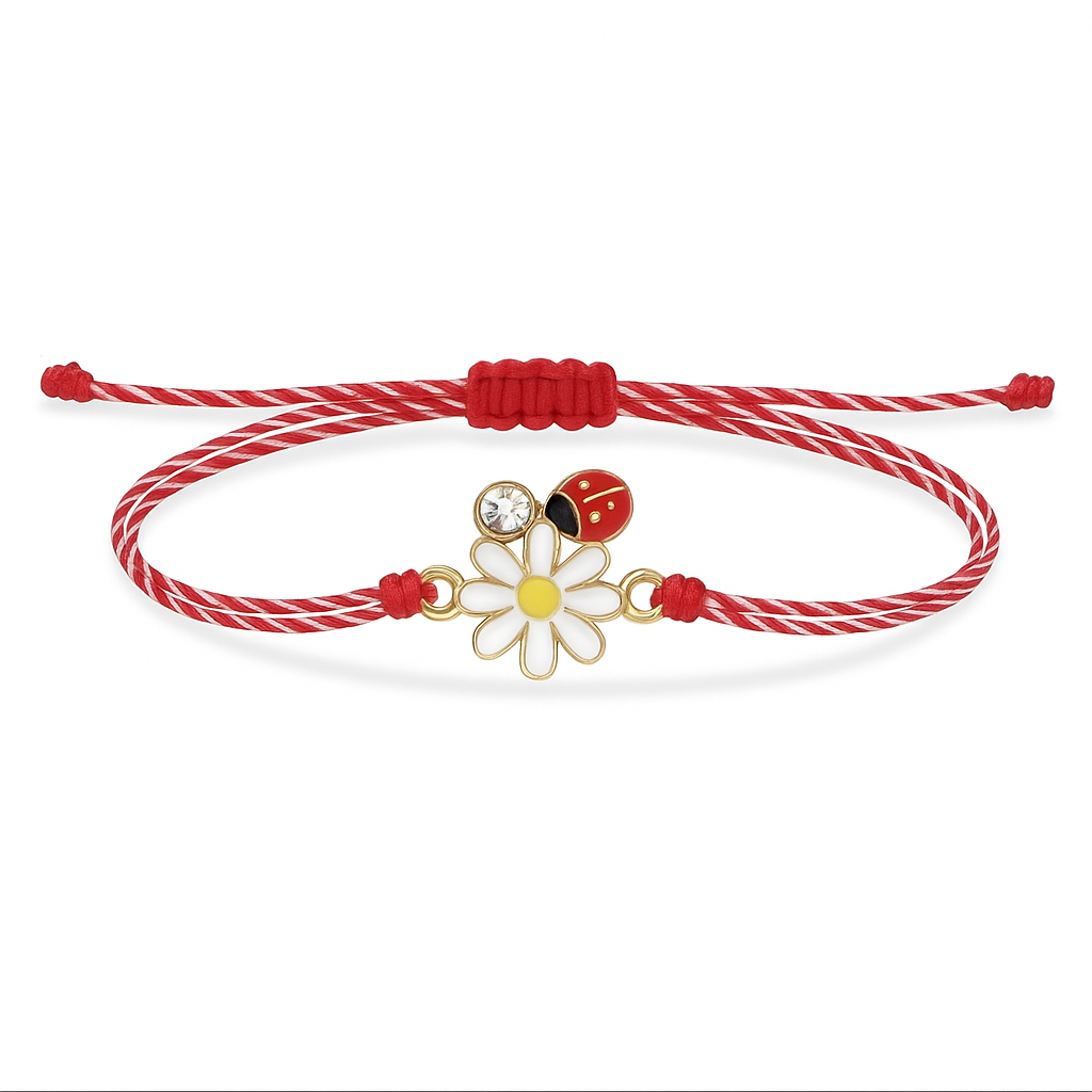 Bracelet with a red and white cord and a gold charm featuring a flower and ladybug on a white background. Mărțișor bracelet with daisy and ladybird charm on red & white cord – Magpie Gems Martisor Ireland