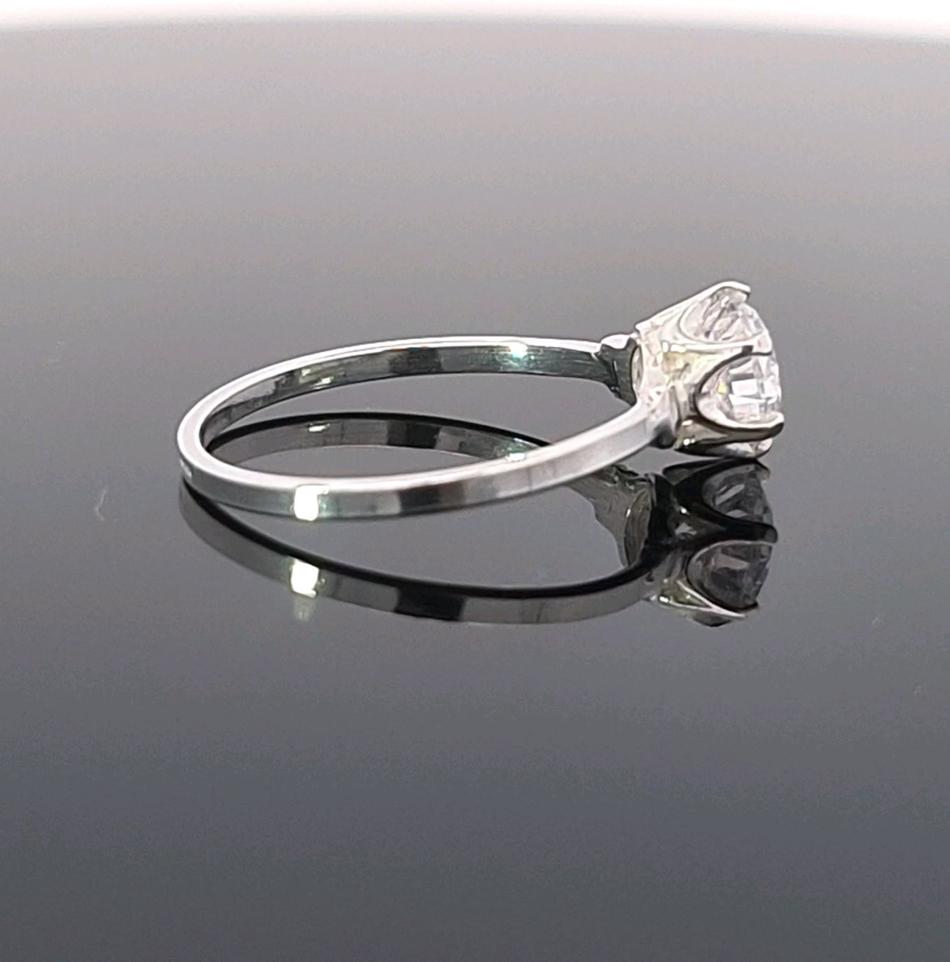 Side angle of nickel-free sterling silver solitaire ring featuring a brilliant-cut cubic zirconia stone by Magpie Gems.