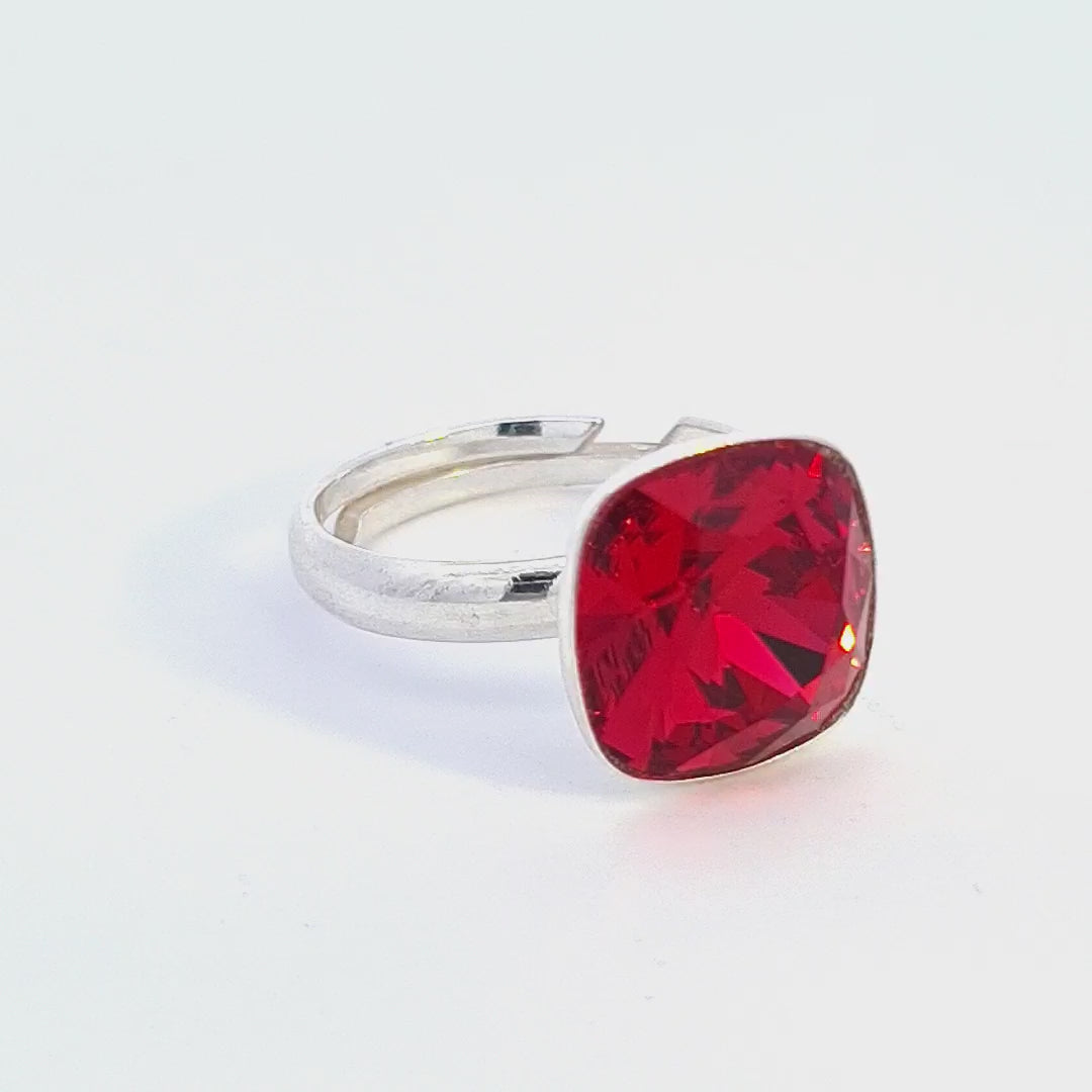 Explore the vibrant allure of the Luminara Cushion Ring, a contemporary ring with Light Siam Red Crystal from Magpie Gems
