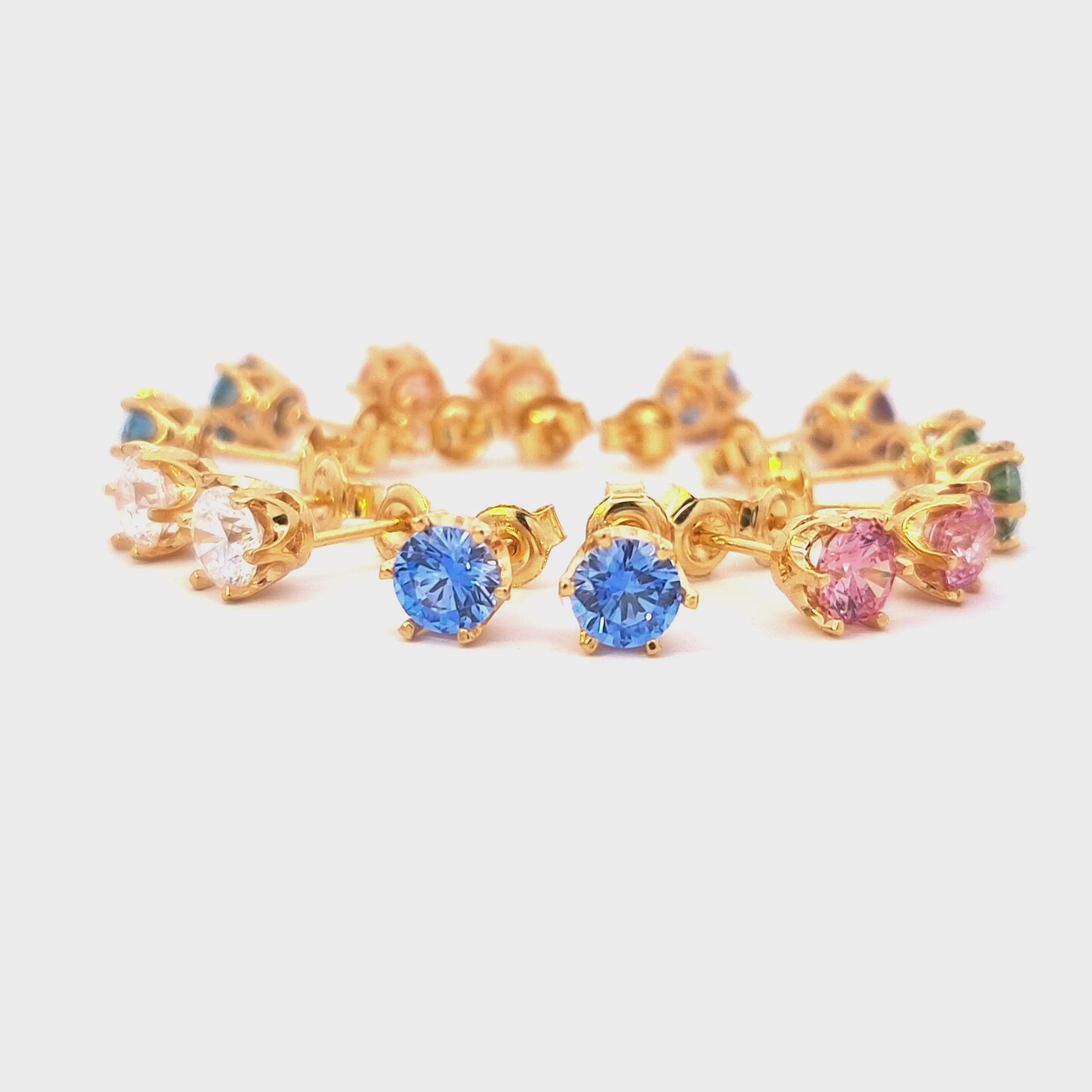 Rotating video of all 7 gold-plated Cubic Zirconia stud earrings in different colours