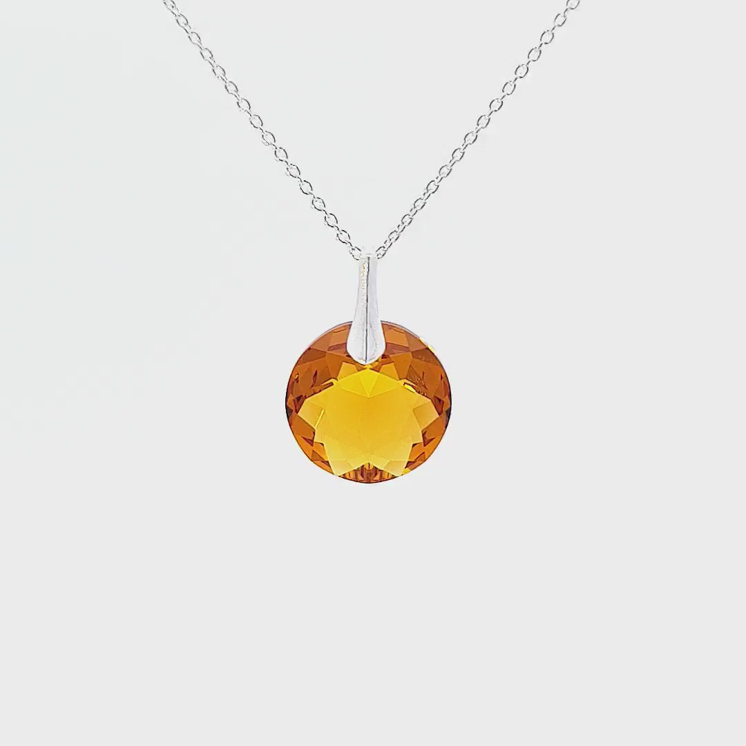 360-degree view of the November Topaz Round Birthstone Crystal Pendant Necklace, a symbol of personal journeys